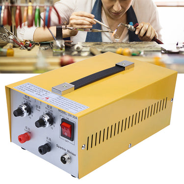 Yellow 30A pulse sparkle spot welder DX-30A positioned in front of a jeweler torch soldering bench.