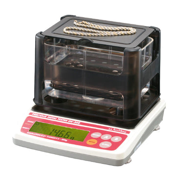 Alfa Mirage GK-300 precious metal tester weighing a gold necklace for purity.