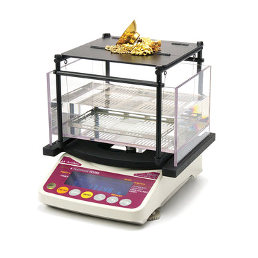 Alfa Mirage GKS-3000 precious metal tester with gold jewelry on the weighing tray.