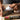 Hand using a white cloth to apply Autosol polish onto a metal tool.