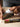 Hand using a white cloth to apply Autosol polish onto a metal tool.