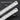 Two identical steel rulers arranged diagonally to display both the front and back usable sides.