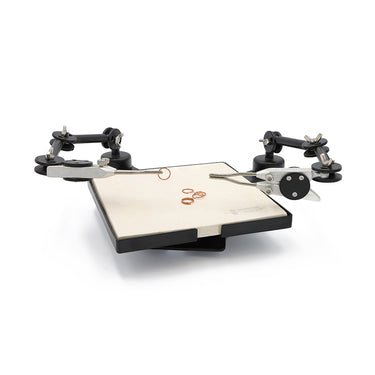 Durston double third hand soldering station holding jewelry components above a ceramic block platform.