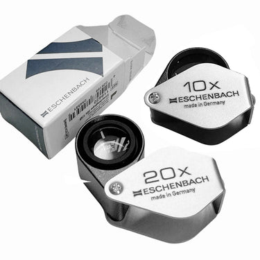 Eschenbach Diamond Triplet Folding Magnifiers in 10X and 20X magnification with original packaging box.