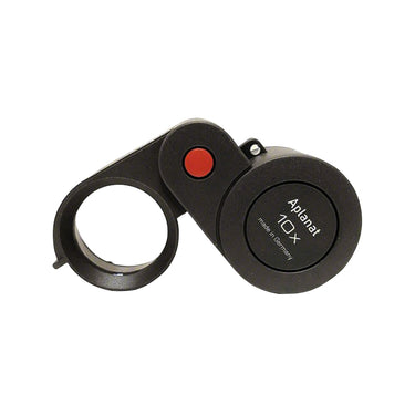 Open Eschenbach 10X plastic folding magnifier displaying the Aplanat lens and red hinge detail.
