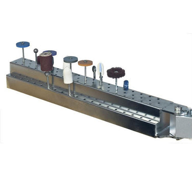 Foredom bur holder arm with stepped tiers holding various rotary burs and bits.