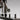 Close-up of placing a Foredom flex shaft handpiece onto the multi handpiece arm peg.