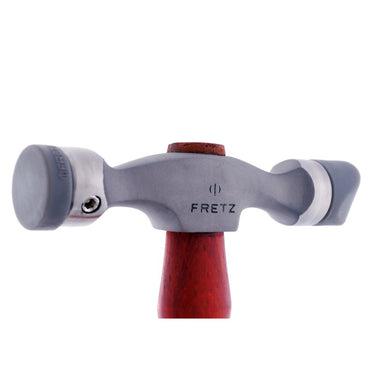 Close-up view of Fretz double-ended insert hammer head fitted with flat and curved nylon tips.