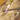 Close-up of an ORCA precision blowtorch flame brazing a metal rod piece with a solder wire on a soldering board