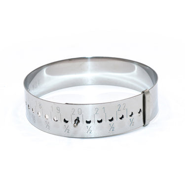 Front view of a round steel bracelet gauge tool showing metric size measurements and a sizing pin.