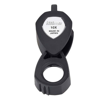 Front view of the Nikon 10X Triplet Loupe showing the iconic silver shield and "Made in Japan" marking.