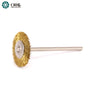 An ORO miniature crimped brass wire wheel brush mounted on a solid metal attachment shank.