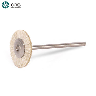 An ORO miniature white goat hair rotary wheel brush mounted on a straight steel attachment shank.