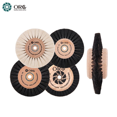 An assortment of four round ORO wooden hub bristle brushes in black and white, with one shown from a side profile.
