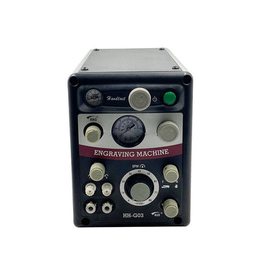 Front panel of GraverMach AT pneumatic jewelry engraver with dual gauges and control dials.