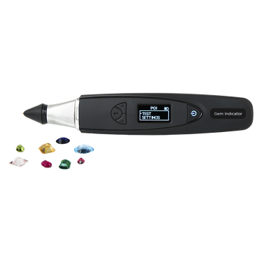 Presidium Gem Indicator shown with a variety of colorful loose gemstones.