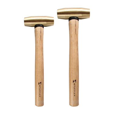 A 1lb and a 2lb Stuccler brass metalworking mallet with wooden handles shown side-by-side.