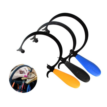 Three Stuccler curved jeweler's saw frames in orange, black, and blue with an inset showing bench use.