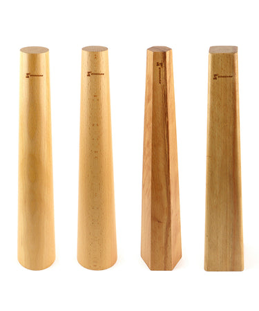 A line of four Stuccler wooden bracelet mandrels standing vertically in round, oval, hexagonal, and square profiles.