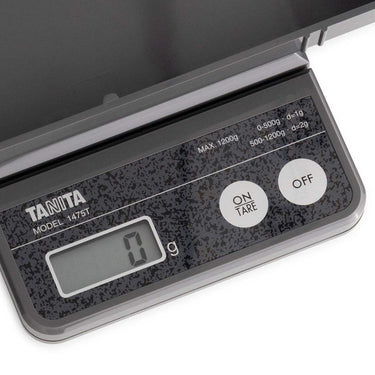 Close-up of Tanita 1475T LCD screen showing 0g and the simple ON/TARE and OFF control buttons.