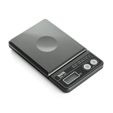 Angled view of the Tanita 1475T mini scale showing the dual-range capacity and mode buttons.