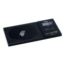 Tanita 1479Z pocket scale weighing silver jewelry pieces on its black platform.