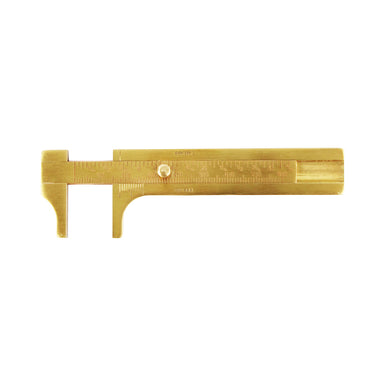 overhead view of a TSK brass vernier caliper tool with its measuring jaws opened to show the metric scale.
