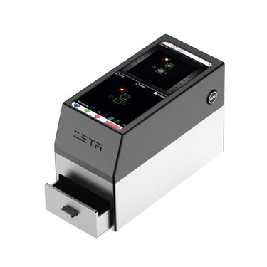 Isometric front view of ZETA natural diamond detector with an open sample drawer and an active testing screen
