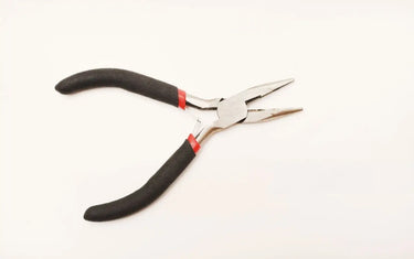 Chain nose pliers with black and red ergonomic handles on a clean white background for jewelry making and wire wrapping.