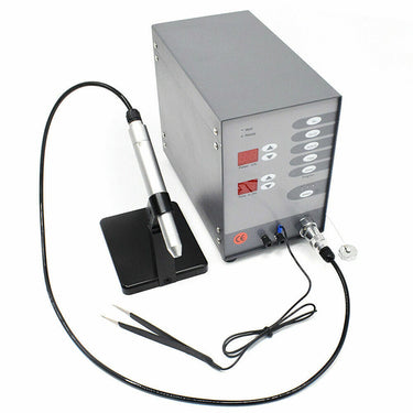 100A pulse argon spot welder connected to welding handpiece on bench stand and ground tweezers.
