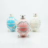 Three Alfa Mirage Happy Egg diamond viewers in blue, pink, and ivory with silver retro carved textures.