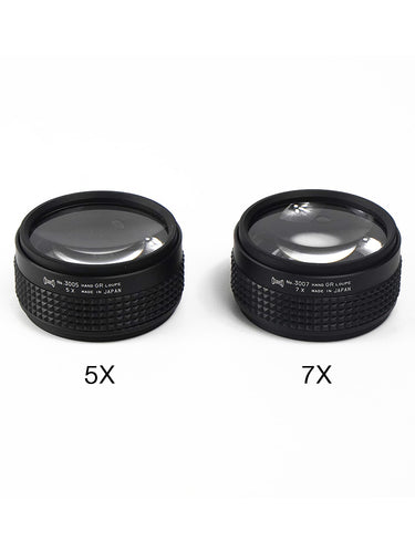 Two Japanese-made Alfa Mirage handheld loupes shown with 5x and 7x magnification labels.