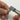 Rotary tool with a grey Alfa Mirage PVA point being used by hand to polish a silver ring.
