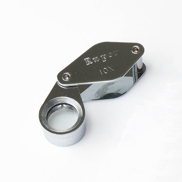 Alfa Mirage Ruper 10x chrome-plated pocket loupe with a swing-out protective metal cover.