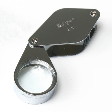 Alfa Mirage Ruper 8x pocket magnifier featuring a large viewing field and durable metal housing.