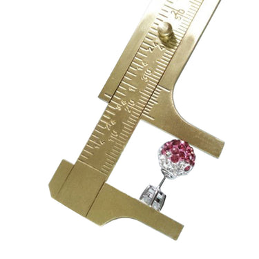 Close-up of a mini brass vernier caliper measuring the outer diameter of a pink crystal earring stud.