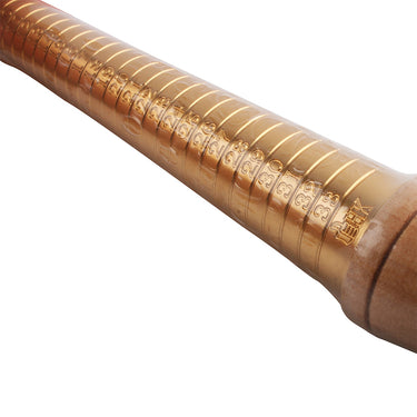 Close-up of the engraved size numbers and line markings on a brass ring sizing mandrel stick.