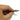 Close-up of a hand holding two miniature pin mandrels showcasing the openings of the clamping collets