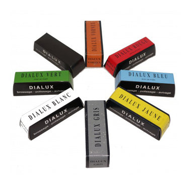 Eight Dialux polishing compound bars arranged in a radial circular pattern.