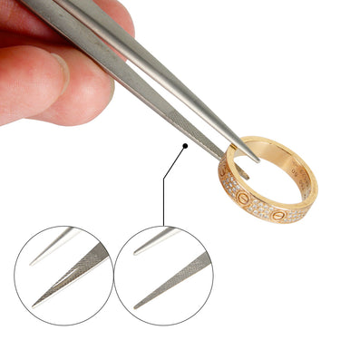 Locking diamond tweezer holding a diamond ring with circular insets showing serrated and smooth tips.