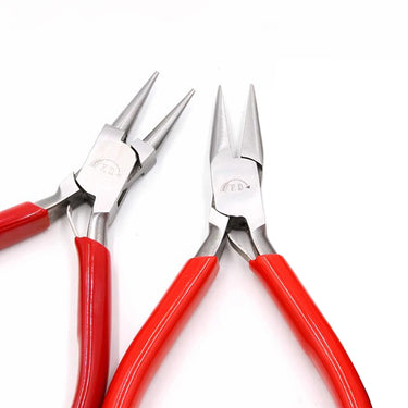 Top view of DICK round nose and flat/chain nose pliers showing the tapered metal tips and red grips.