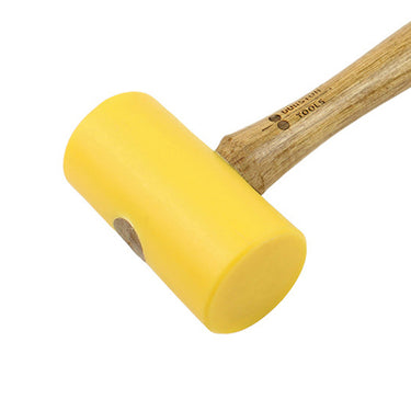 Close-up view of a yellow cylindrical Durston polyurethane mallet head secured to its wood handle.