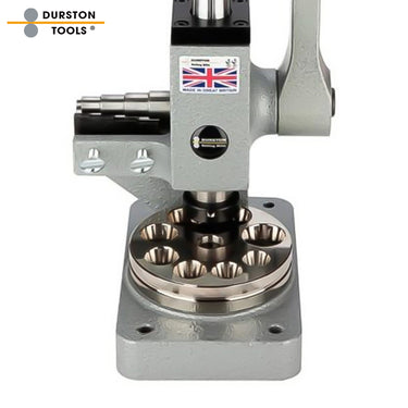 Close-up of Durston ring reducer base showing the polished multi-hole circular reduction plate.