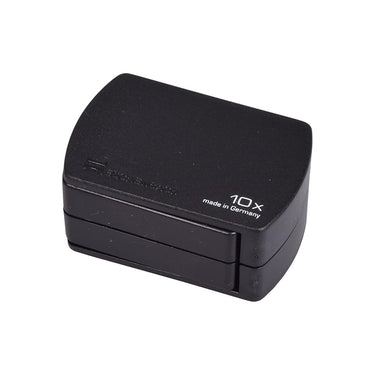 Closed Eschenbach folding magnifier in a compact black plastic case with "made in Germany" text.