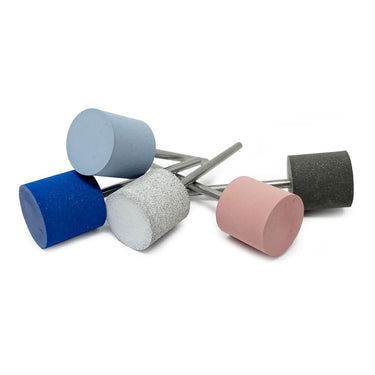 Five assorted EVE Universal silicone polishing cylinder pins lying scattered together on a white surface.