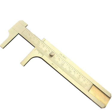 Diagonal view of a fine brass pocket sliding caliper with dual inch and meter measurement scales.
