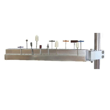 Side view of Foredom bur holder arm holding rotary burs mounted on vertical stand pole.