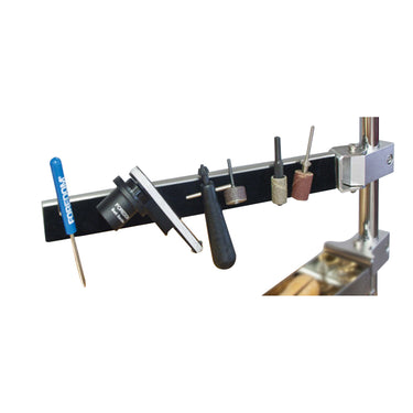 Foredom magnetic arm mounted on motor hanger stand pole holding handpiece tools.