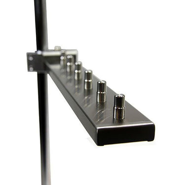 Empty Foredom multi handpiece arm showing metal pegs for organizing flex shaft handpieces.