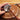 Metalsmith sinking and shaping metal bowl into a leather sandbag using Fretz HMR-4 hammer.